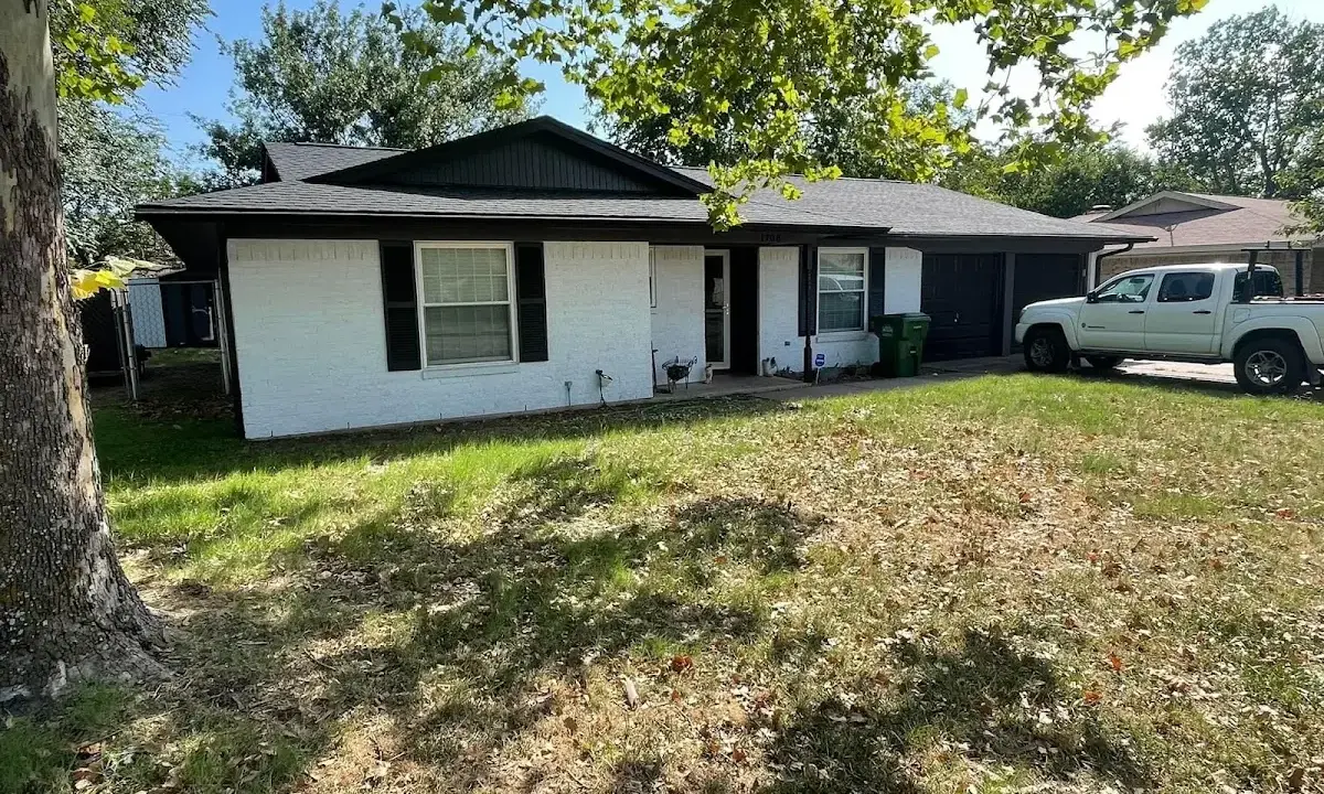 Professional roofing crew working on a residential roof in North Branford